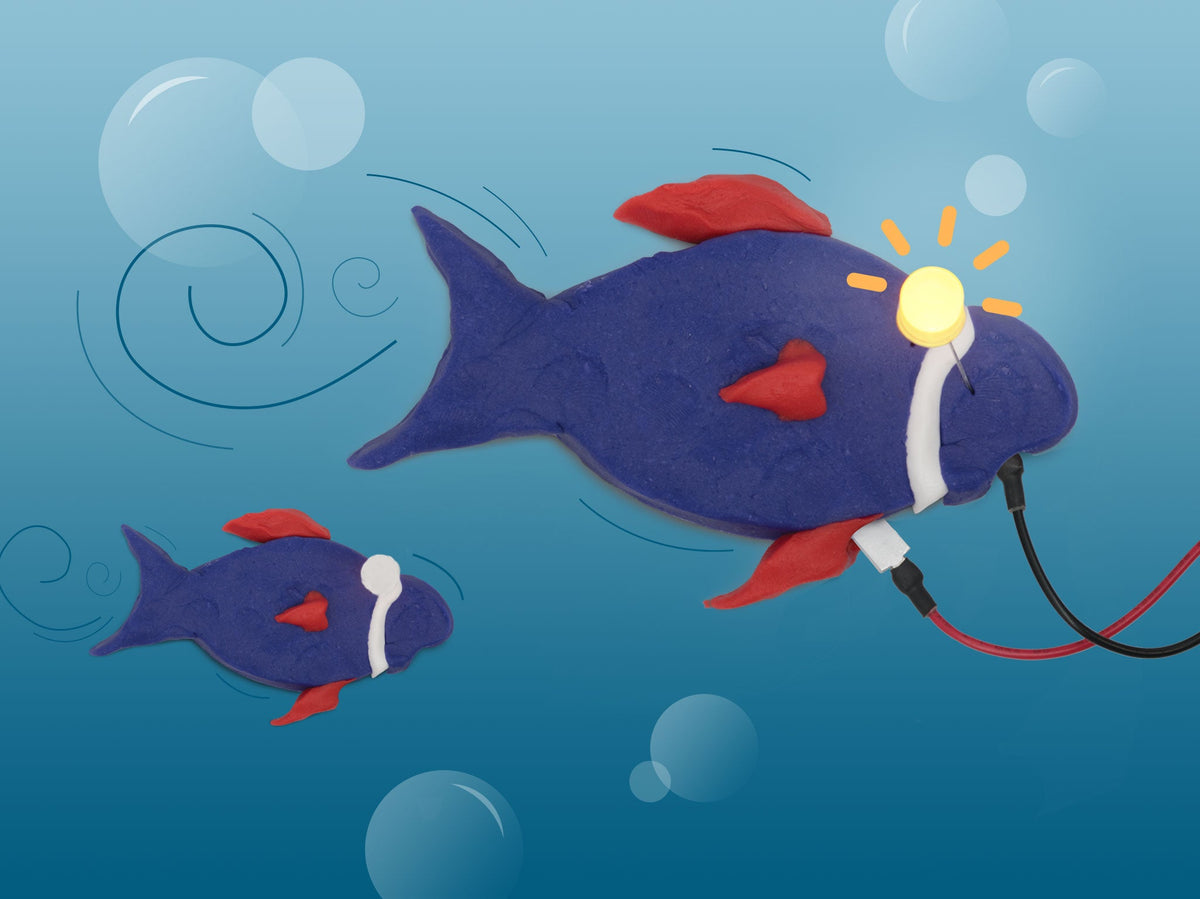 Purple dough fish with red fins and a glowing LED eye swimming underwater