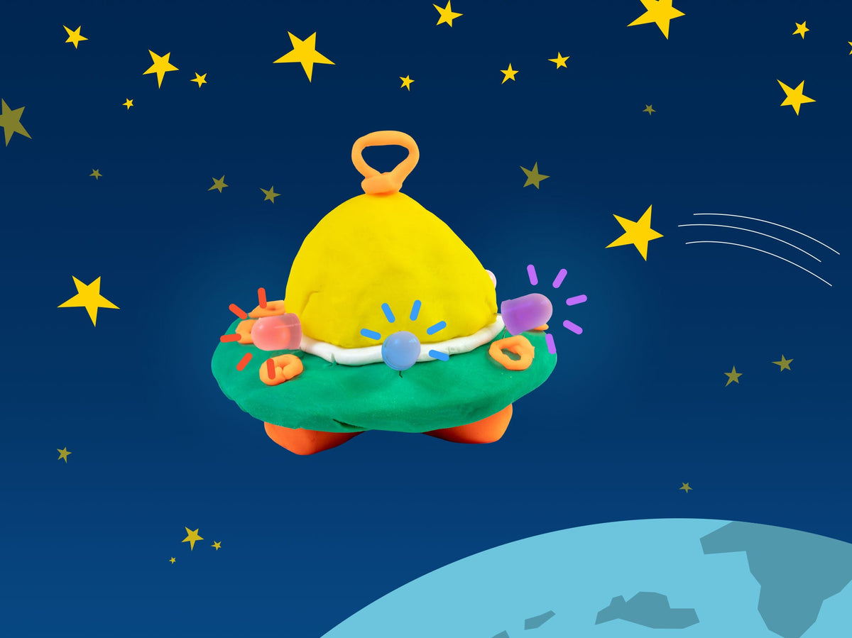 Green and yellow dough UFO with glowing LEDs flying through space