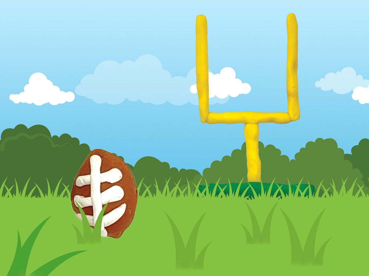 Brown dough football with white laces in front of a yellow dough goalpost