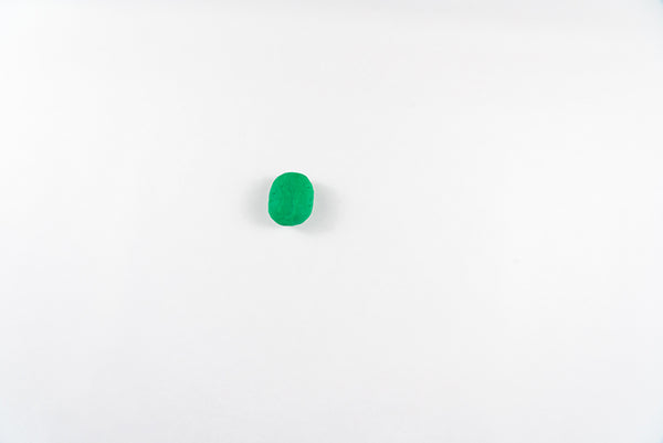 Small round piece of green dough