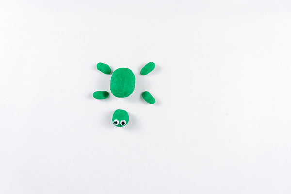 Turtle body with four legs and a head with googly eyes