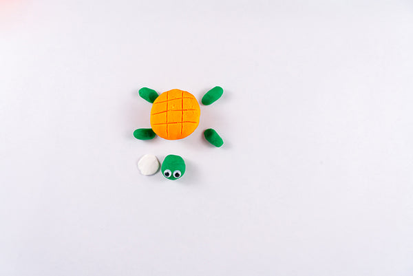 Turtle with an orange dough shell