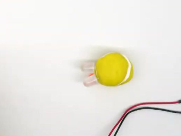 Yellow dough chick head with two LEDs pushed in