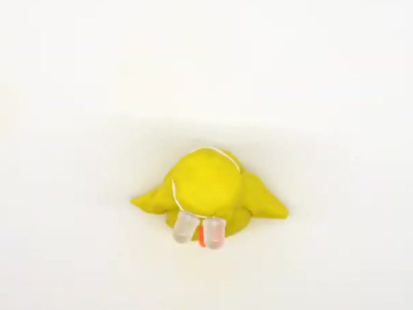 Chick head attached on top of the yellow body with wings