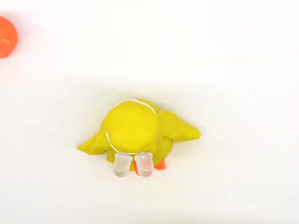 Yellow dough chick with orange feet and LED eyes