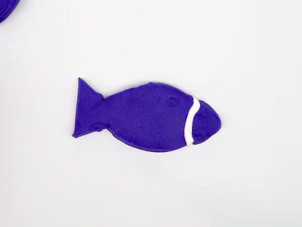 Purple dough fish with a white insulating strip between the head and the body