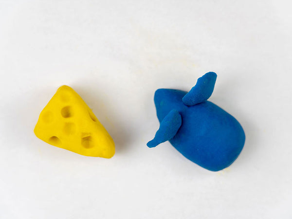 Yellow dough cheese next to a blue dough mouse with two ears