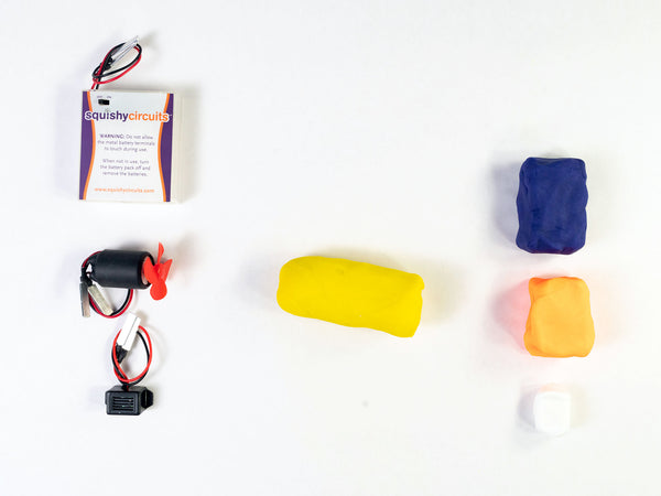 Yellow dough submarine body next to the fan motor and buzzer