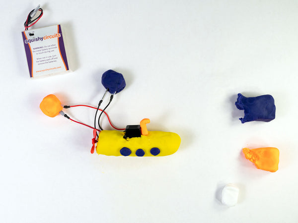 Fan motor and buzzer wires connected to an orange ball and a blue ball