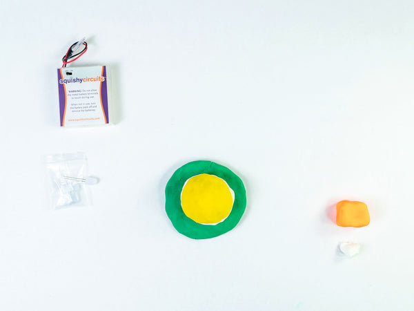 Yellow dough dome on a green dough disc